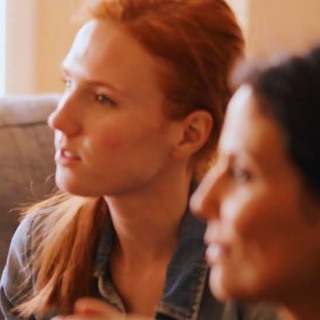 Two people talking/listening